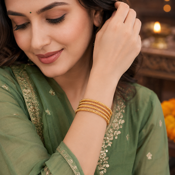 Plain intricate gold bangle set (set of 4 )