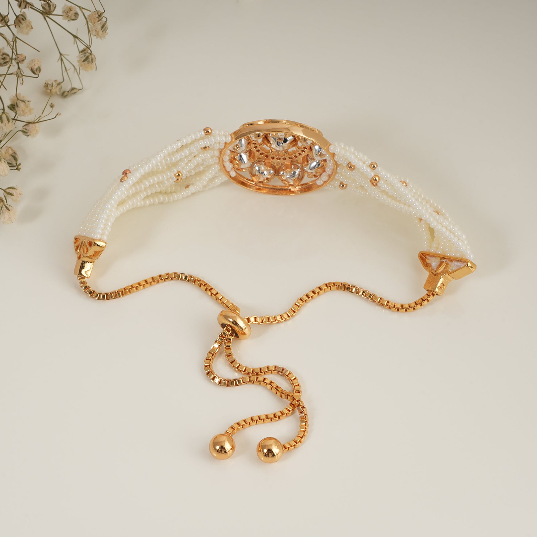 Stunning gold plated floral kundan pearl adjustable bracelet