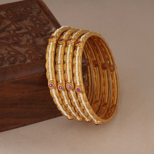 Elegant gold plated pearl bangle set (set of 4)