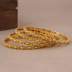 Sleek elegant antique gold plain bangle set (set of 4)