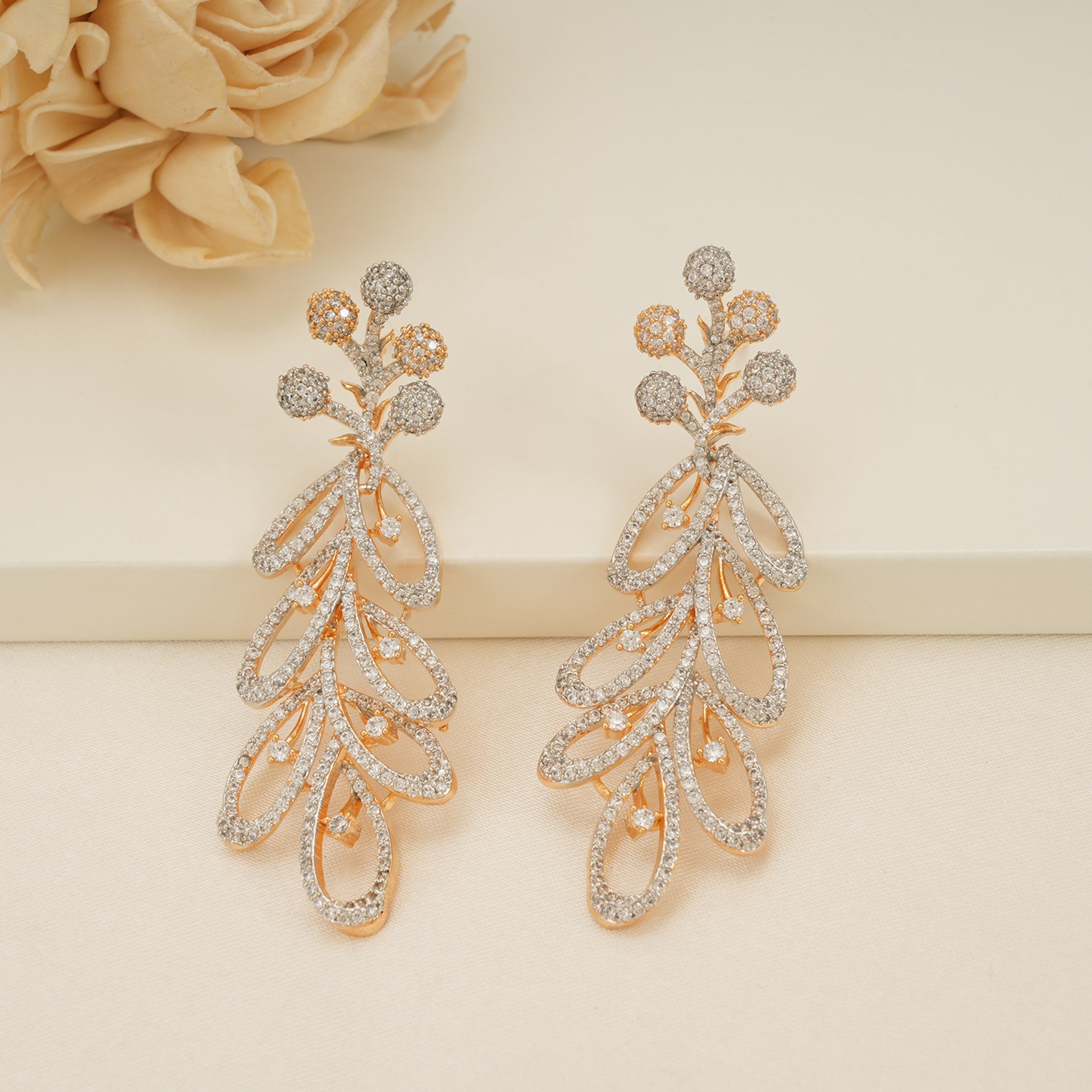 Long gold plated diamond studded dangler earring