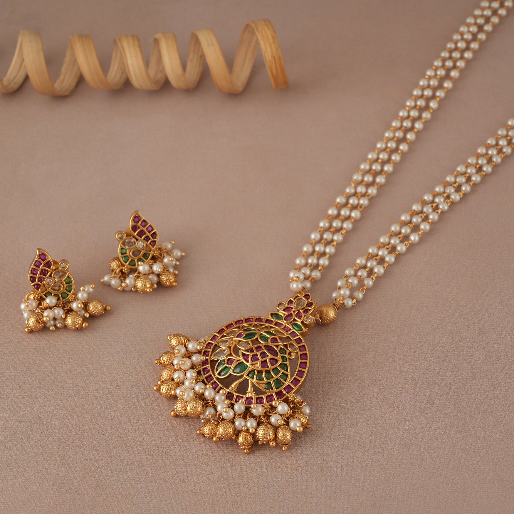 Stunning gold plated pearl peacock pendant set with earring