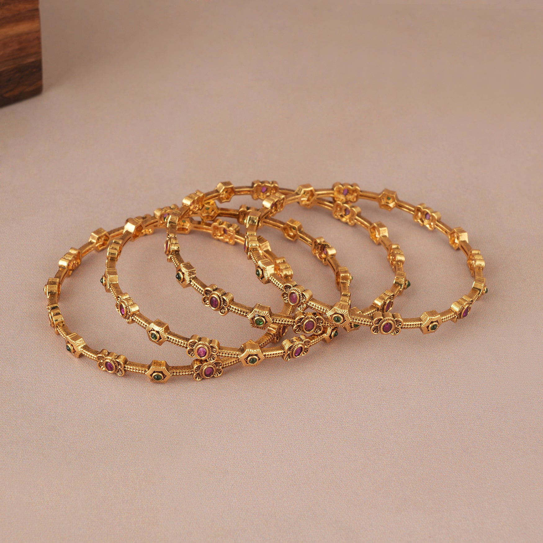 Sleek antique gold multicolor stone bangle set ( set of 4)