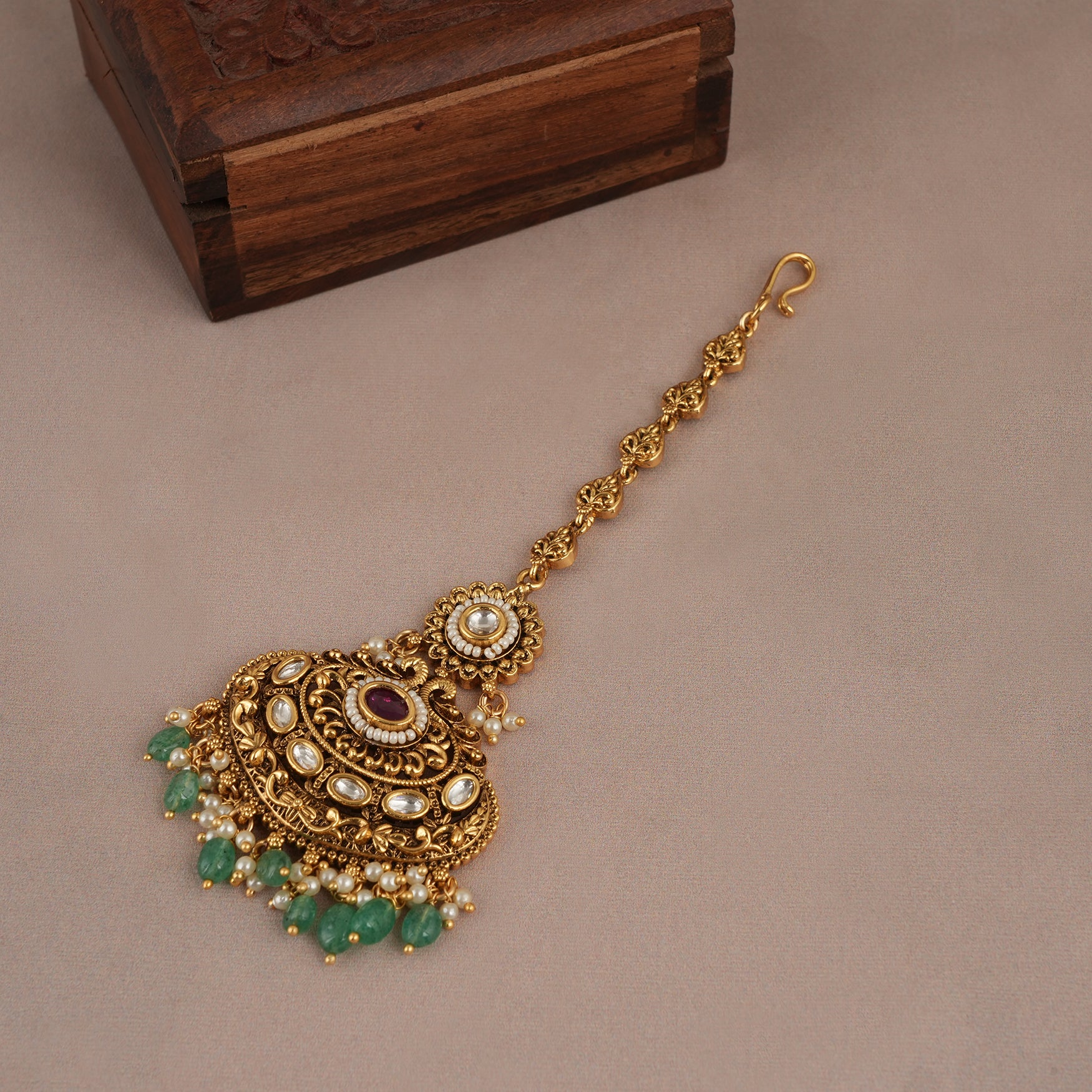 Beautiful antique gold plated green stone maangtika