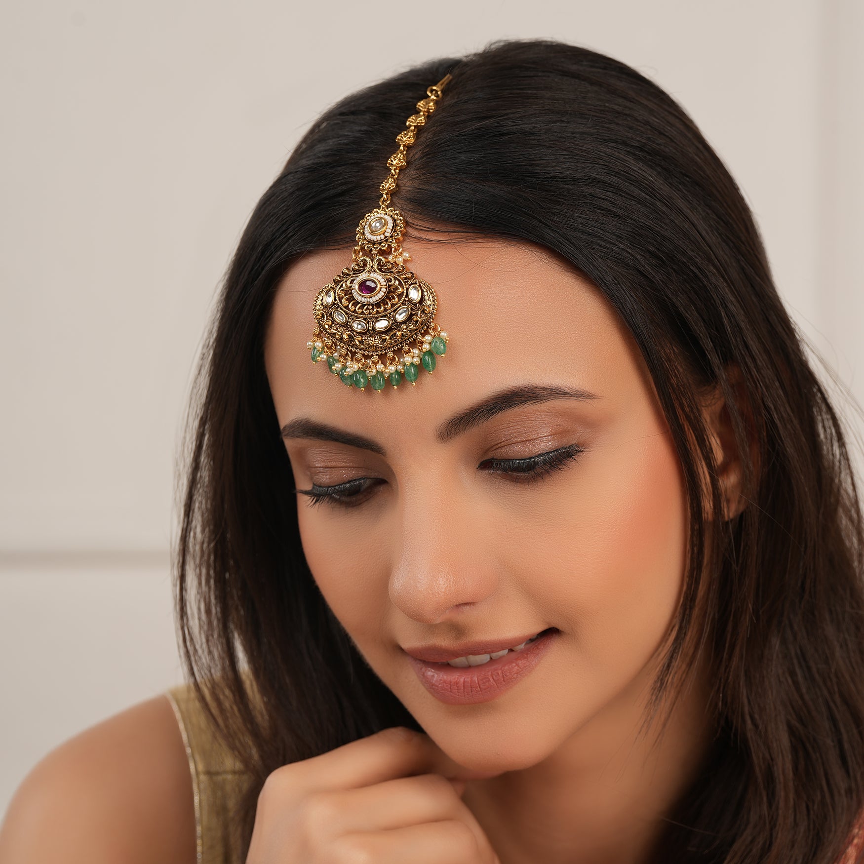 Beautiful antique gold plated green stone maangtika