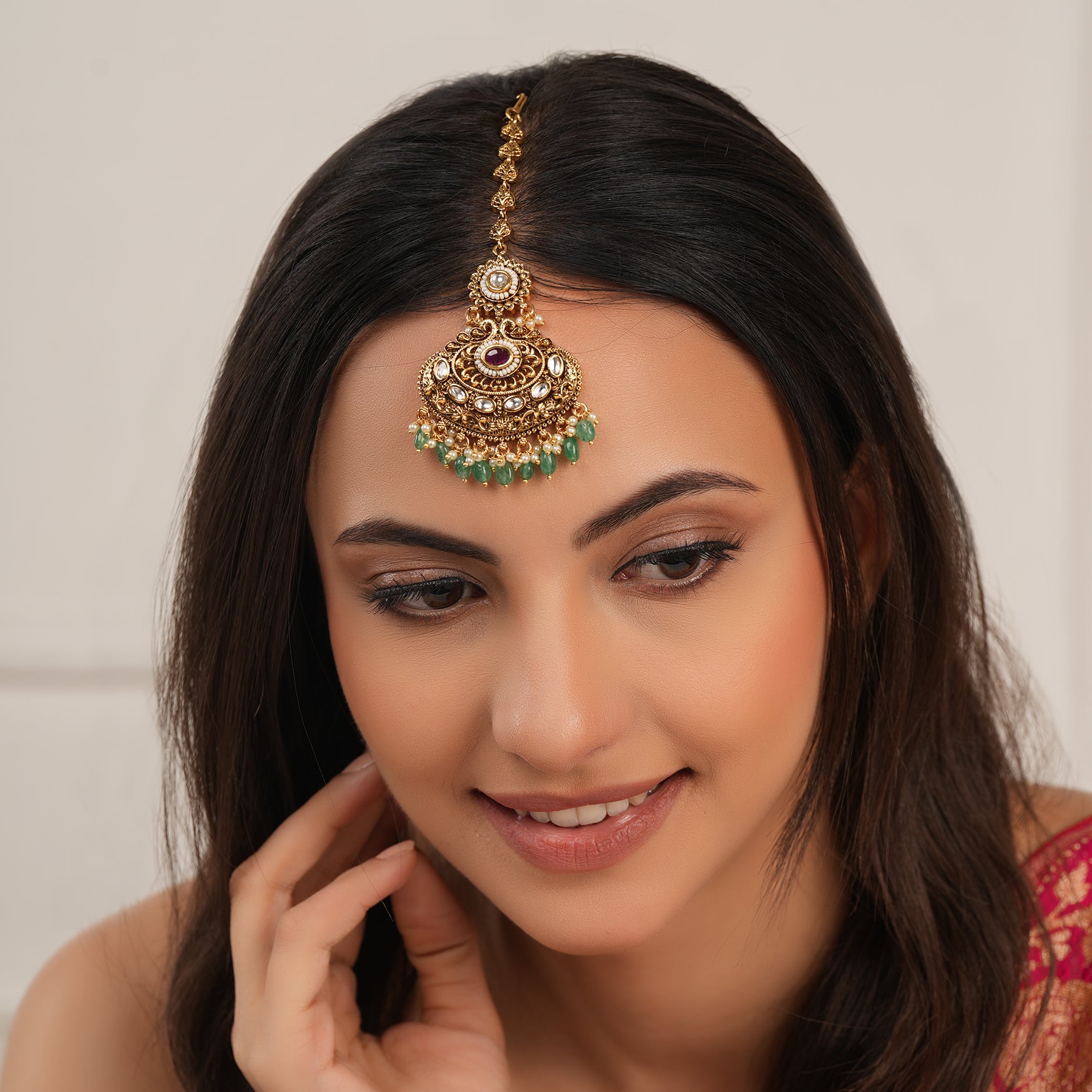 Beautiful antique gold plated green stone maangtika