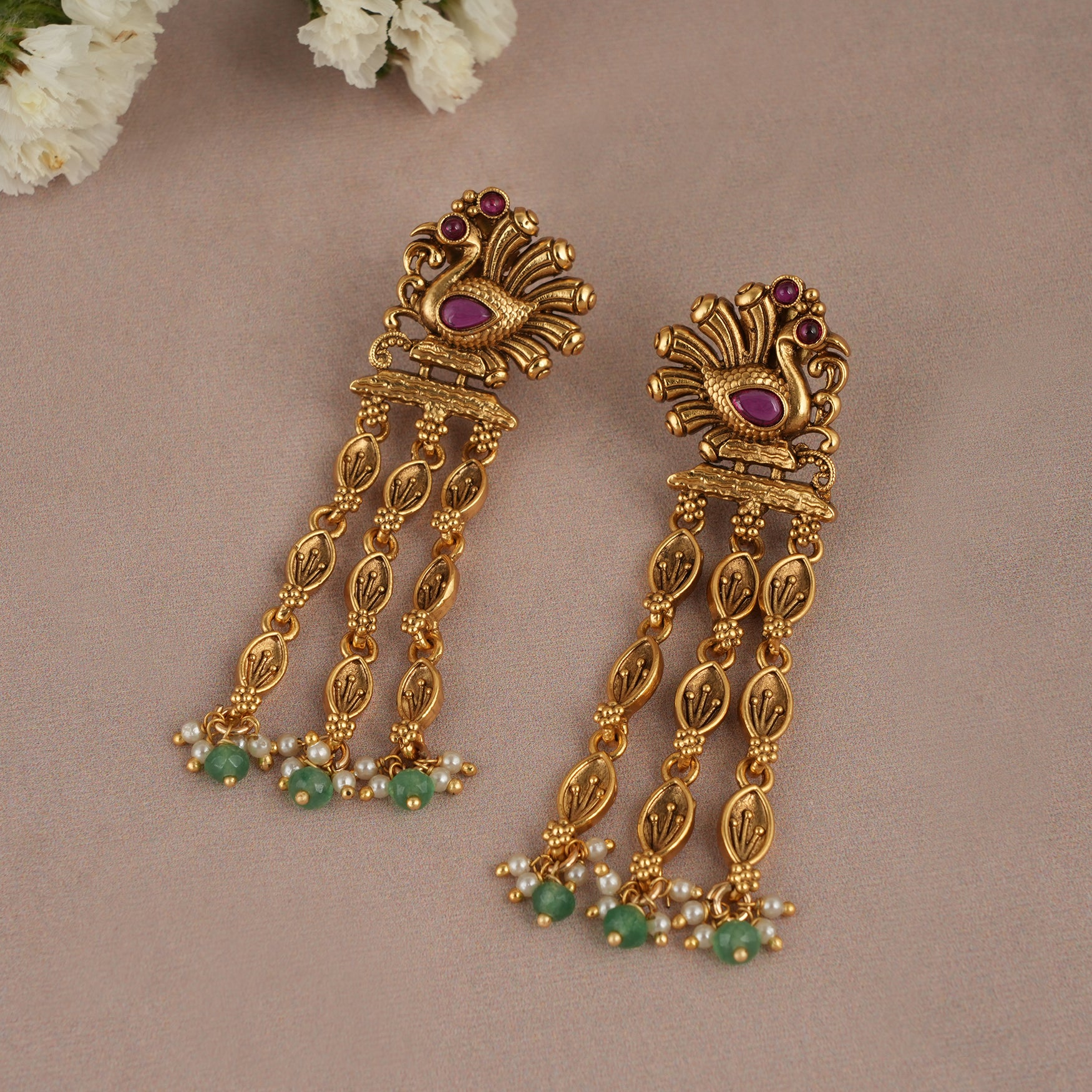 Long antique gold plated peacock earring