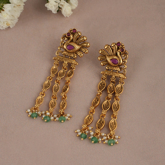 Long antique gold plated peacock earring