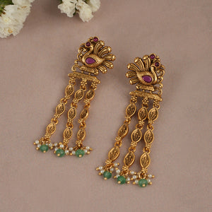Long antique gold plated peacock earring