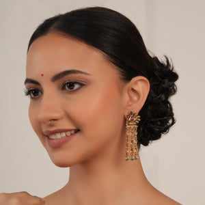 Long antique gold plated peacock earring