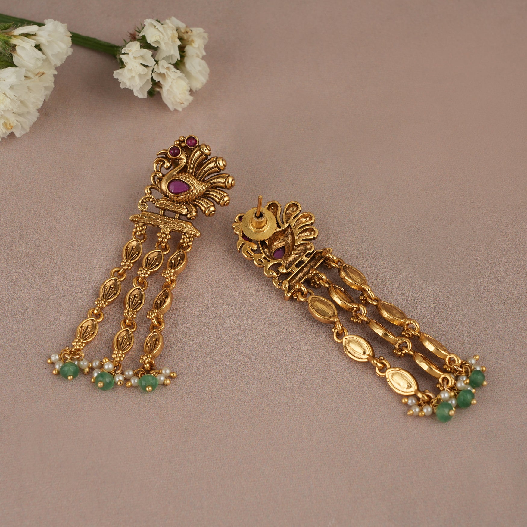 Long antique gold plated peacock earring