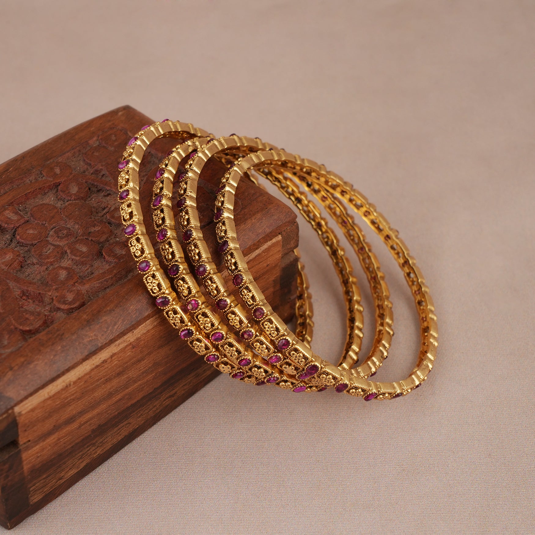 Beautiful antique gold plated sleek ruby stone bangle set