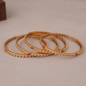 Sleek antique gold ruby stone bangle set