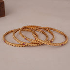 Sleek antique gold ruby stone bangle set