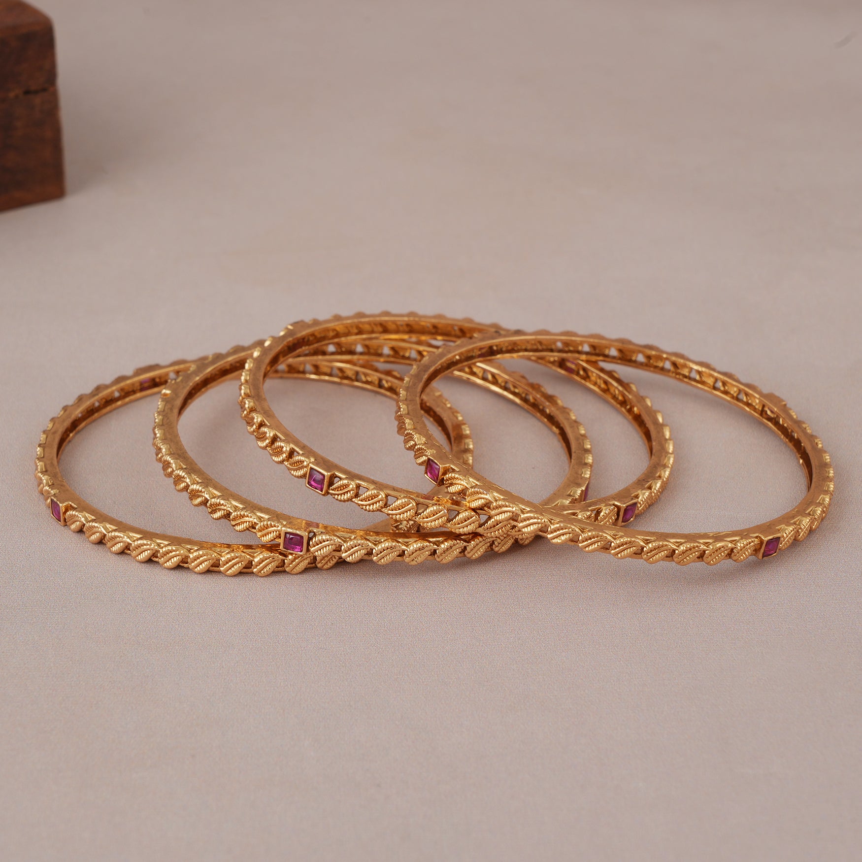 Sleek antique gold ruby stone bangle set