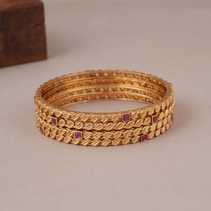 Sleek antique gold ruby stone bangle set