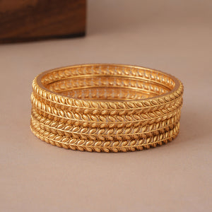 Beautiful sleek leaf antique gold bangle set ( set of 4 )