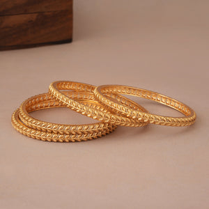 Beautiful sleek leaf antique gold bangle set ( set of 4 )