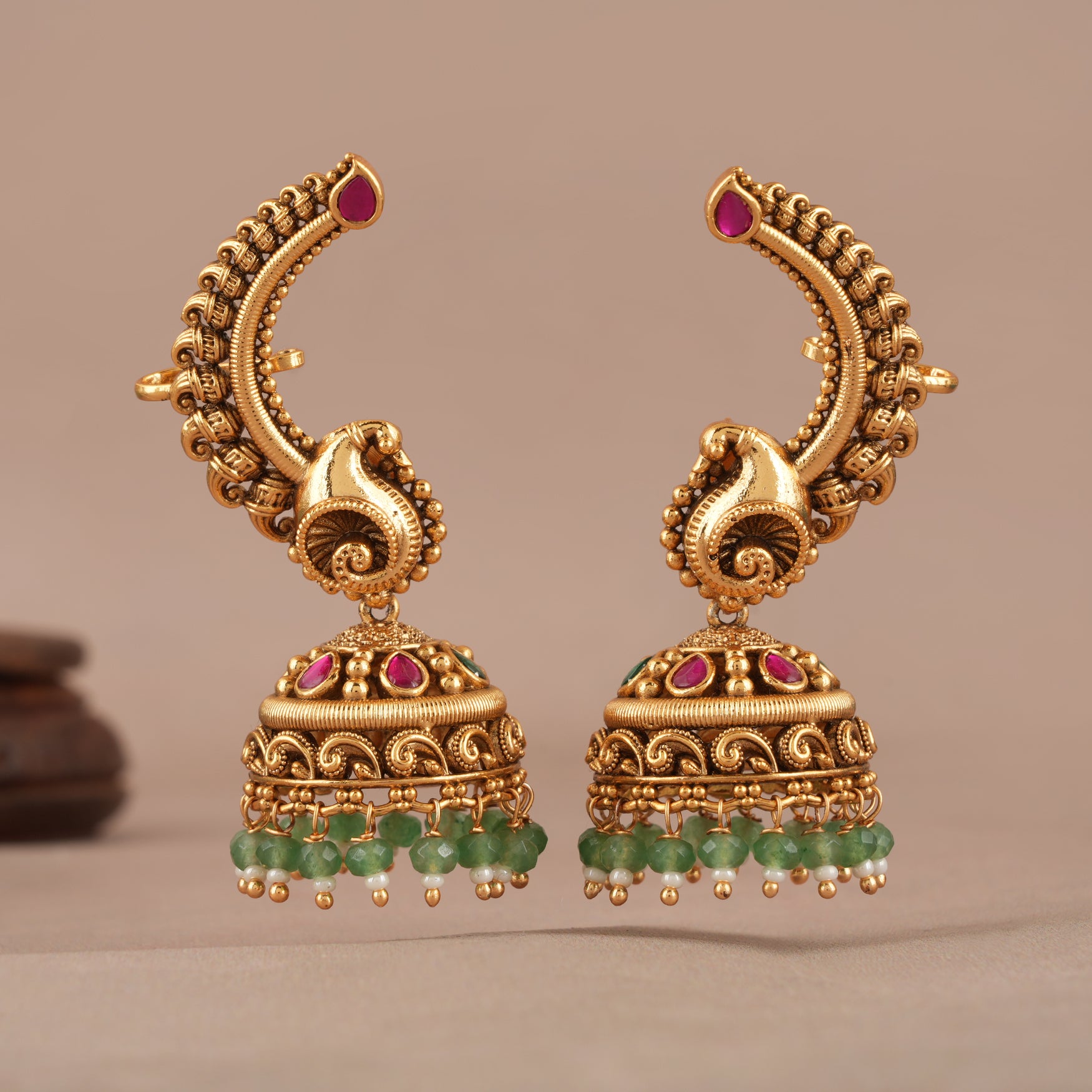 Stunning stone drop antique gold jhumka earring