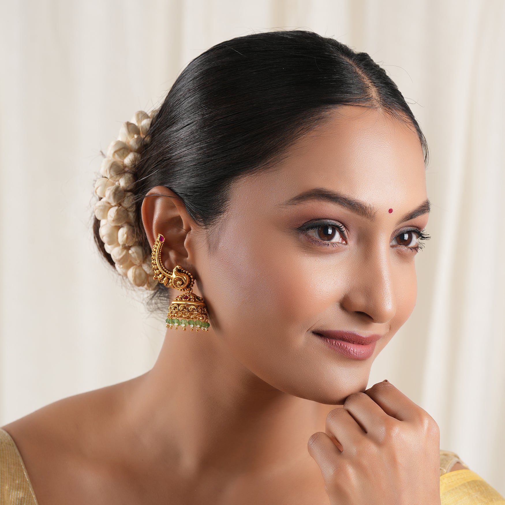 Stunning stone drop antique gold jhumka earring