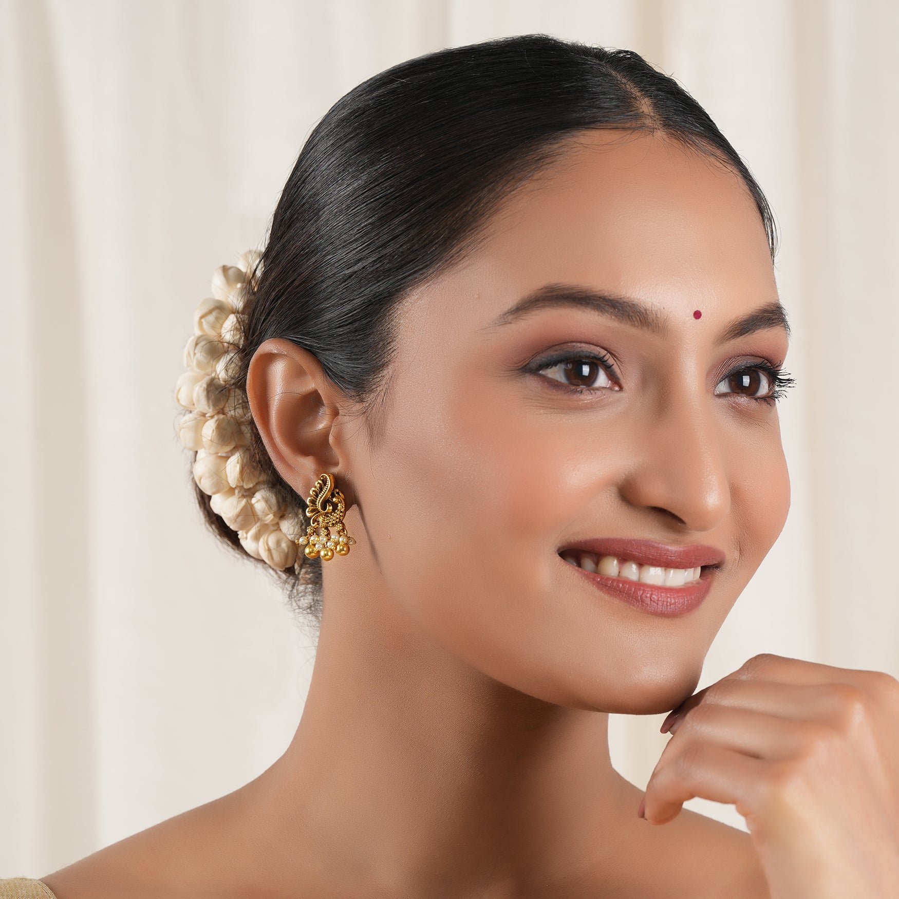 Pearl drop antique gold peacock earring