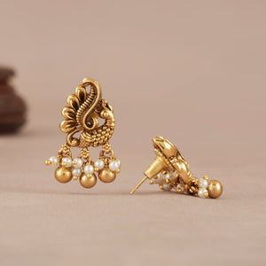 Pearl drop antique gold peacock earring