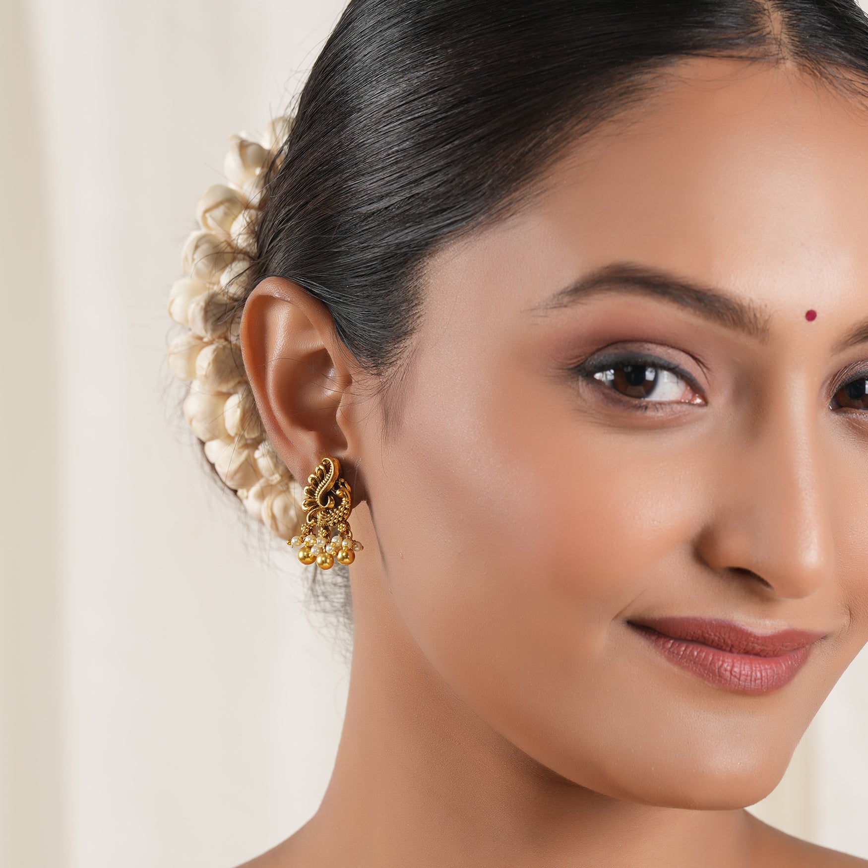 Pearl drop antique gold peacock earring