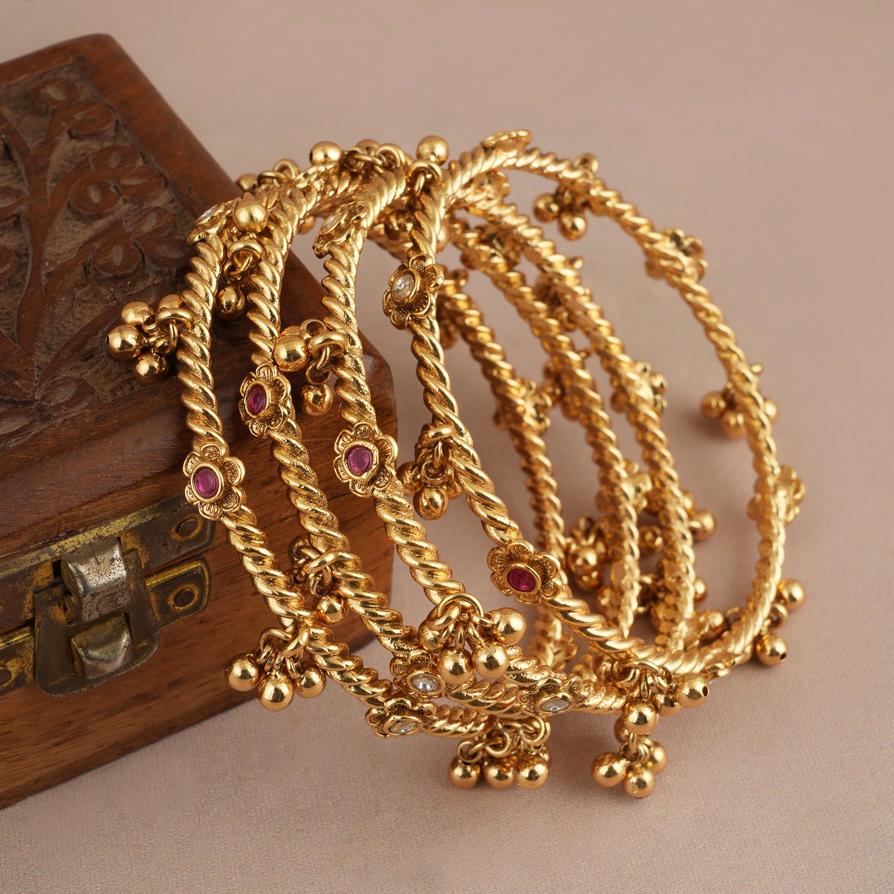 Beautiful antique gold stone ghungroo bangle set ( set of 4 )