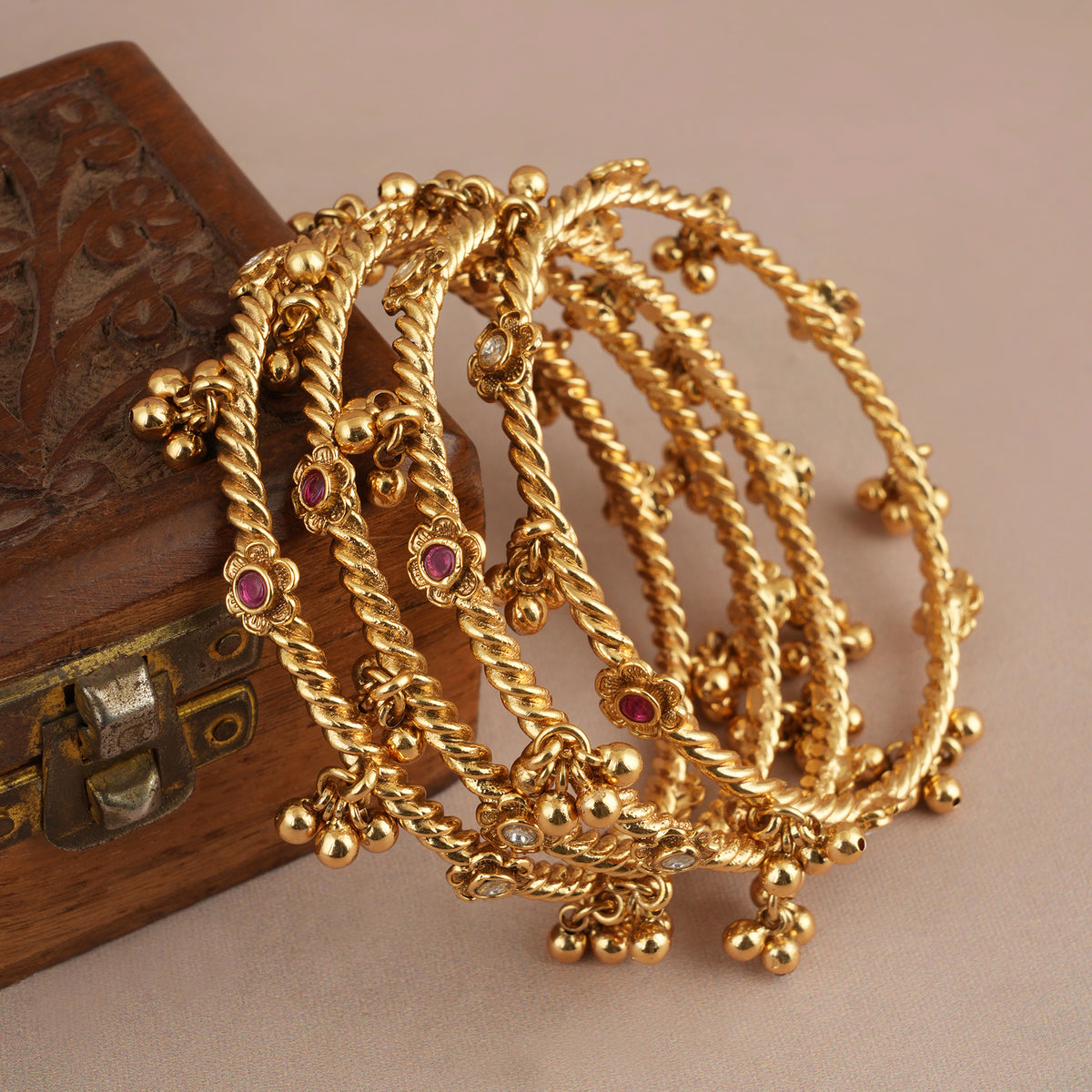 Beautiful antique gold stone ghungroo bangle set ( set of 4 )