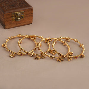 Beautiful antique gold stone ghungroo bangle set ( set of 4 )