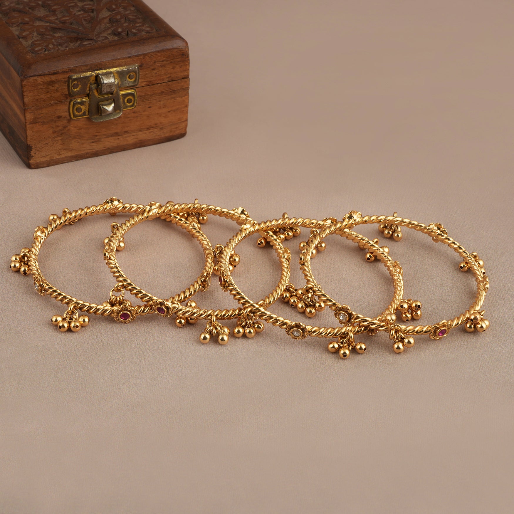 Beautiful antique gold stone ghungroo bangle set ( set of 4 )