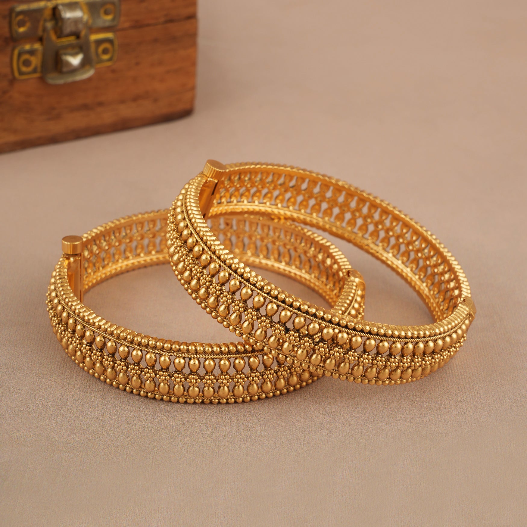 Broad gold plated bangle set
