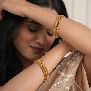 Broad gold plated bangle set