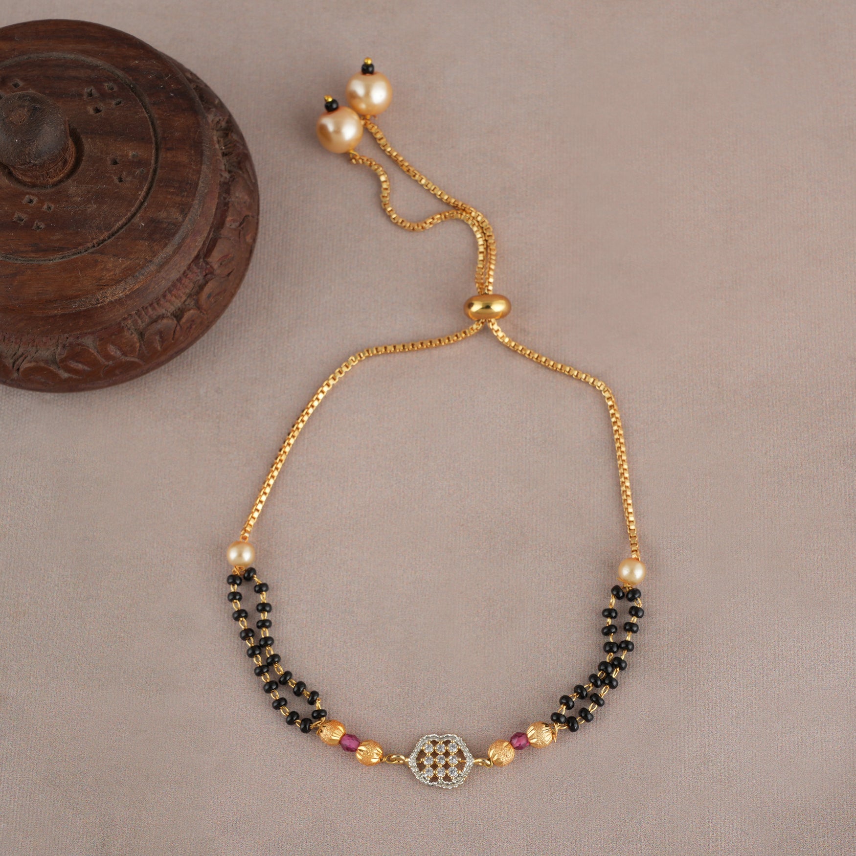 Sleek gold plated free size mangalsutra bracelet