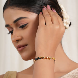 Sleek gold plated free size mangalsutra bracelet