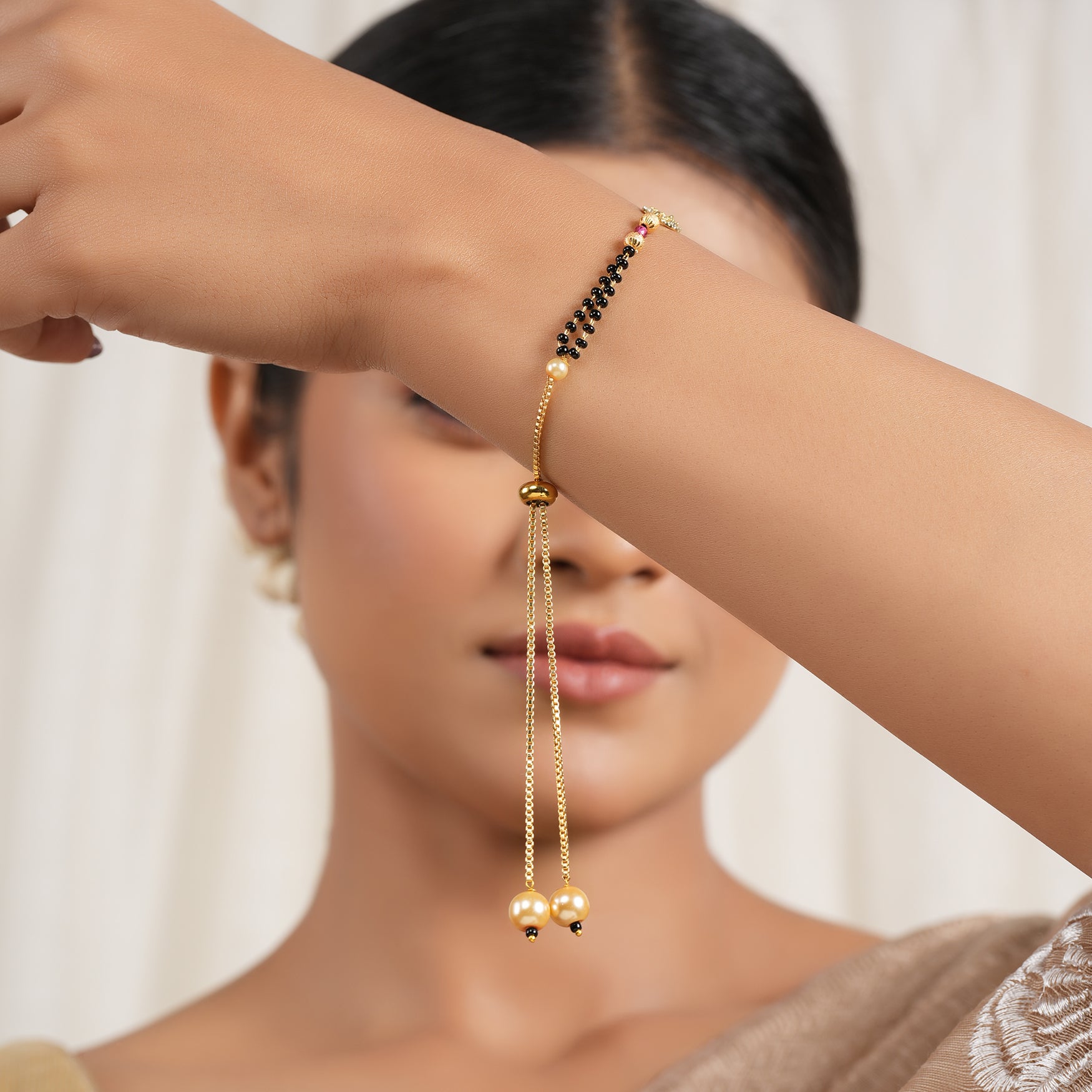 Sleek gold plated free size mangalsutra bracelet