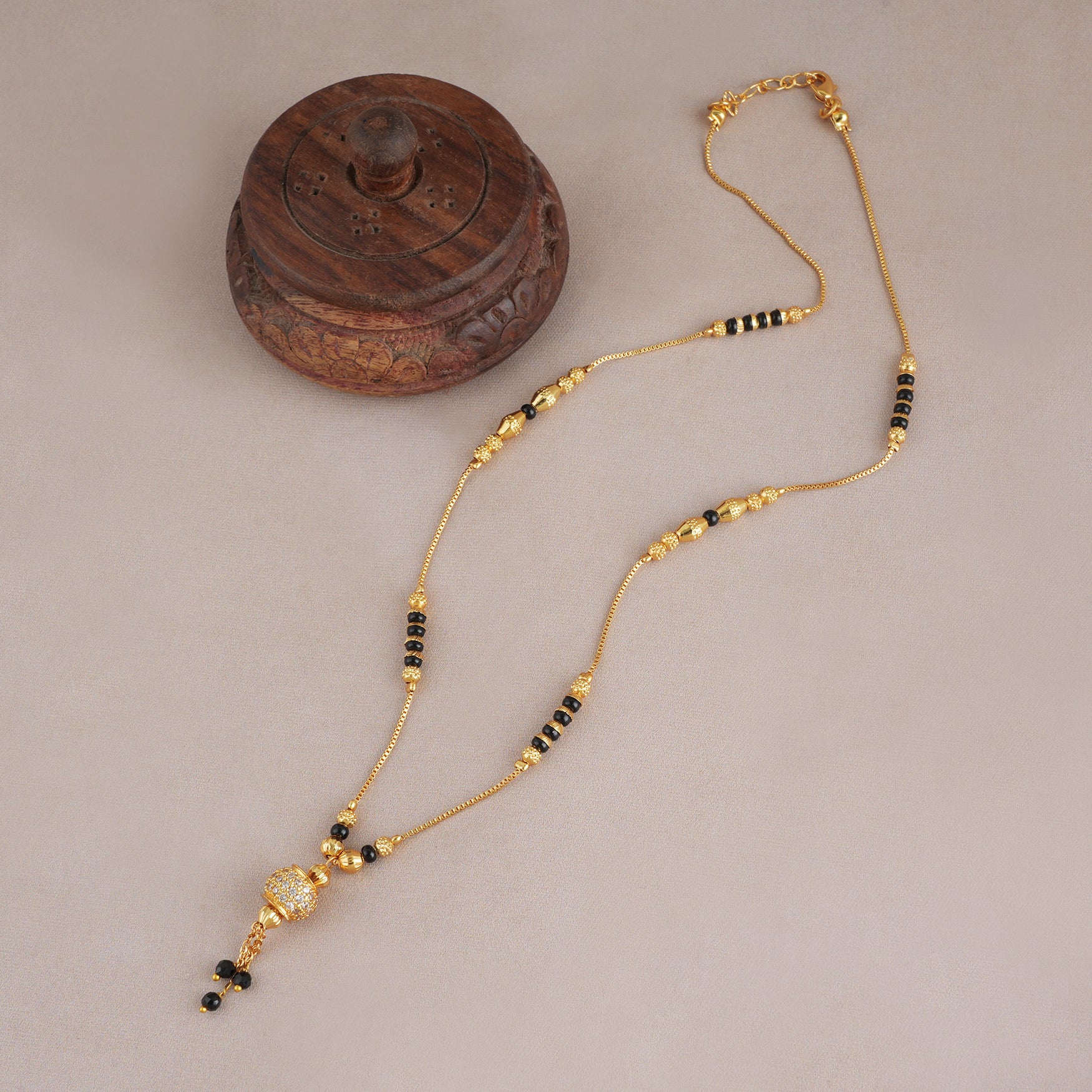 Sleek gold plated diamond ball mangalsutra