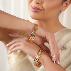 Broad gold plated carved bangle set