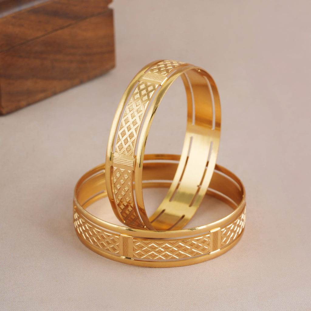 Broad gold plated carved bangle set