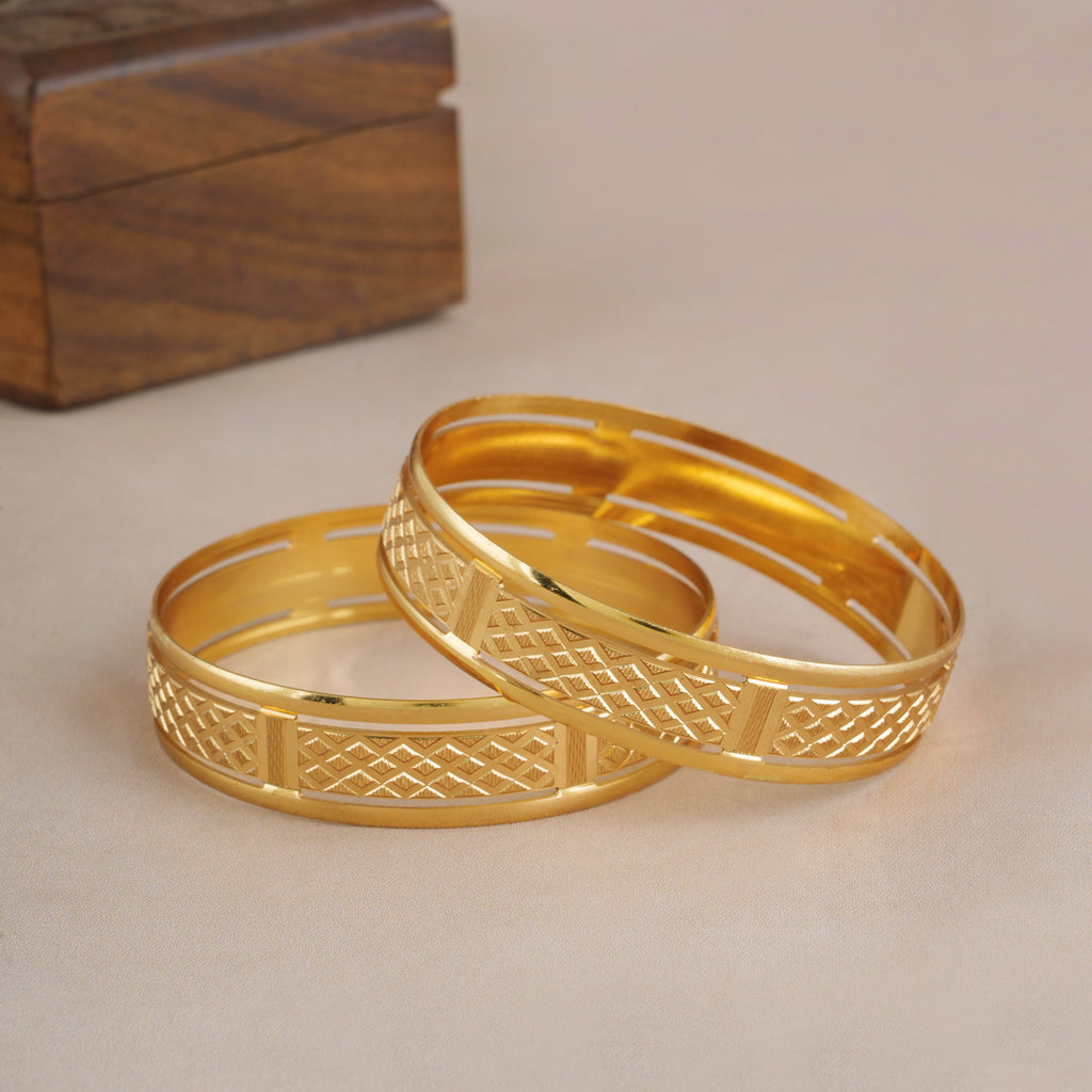 Broad gold plated carved bangle set