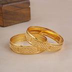Broad gold plated carved bangle set