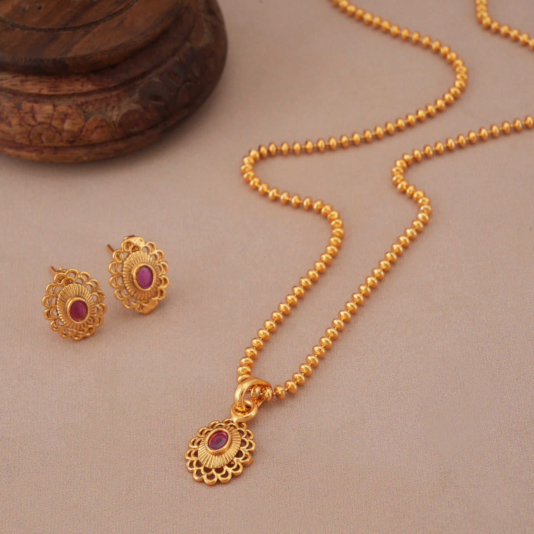 Cute oval ruby gold plated pendant set