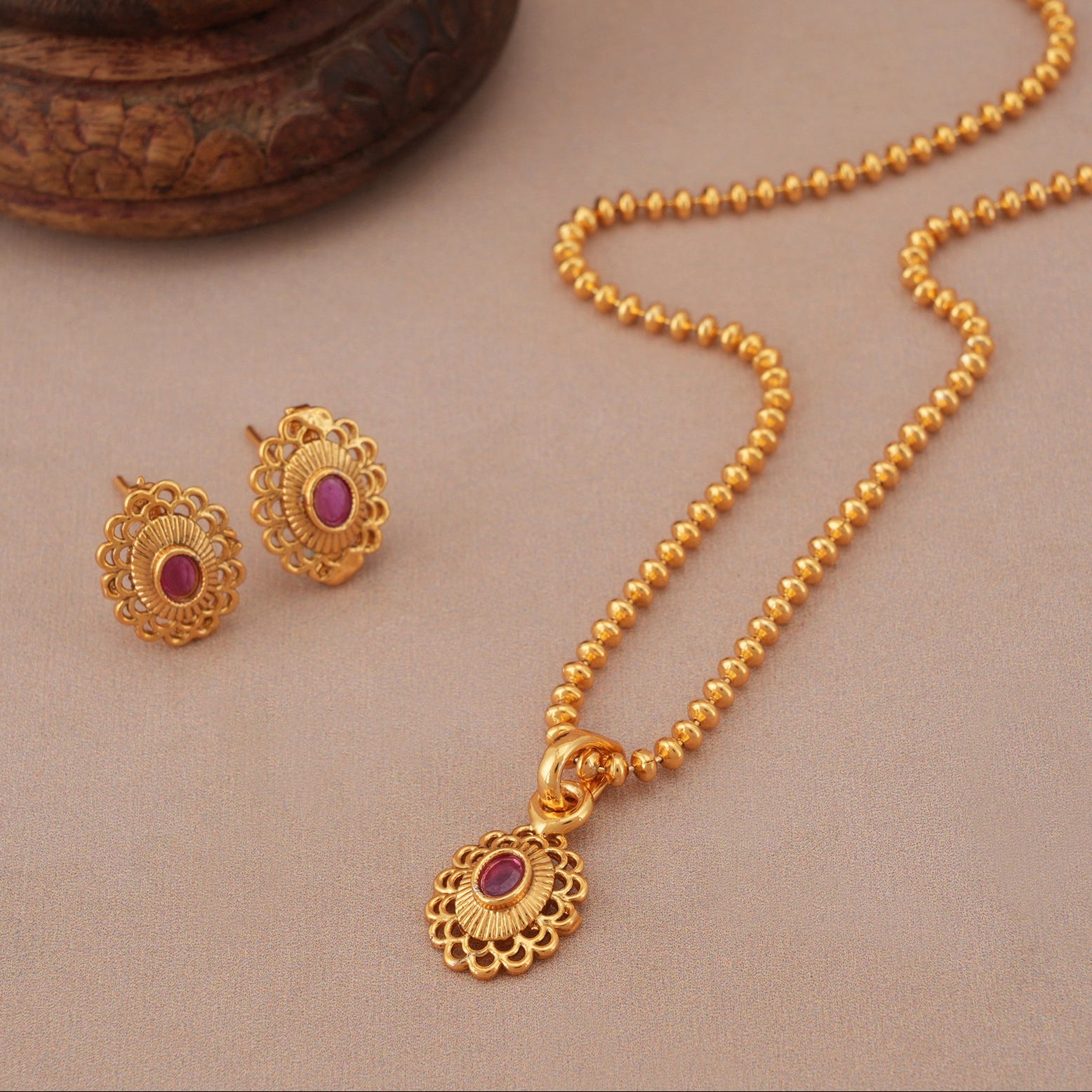 Cute oval ruby gold plated pendant set