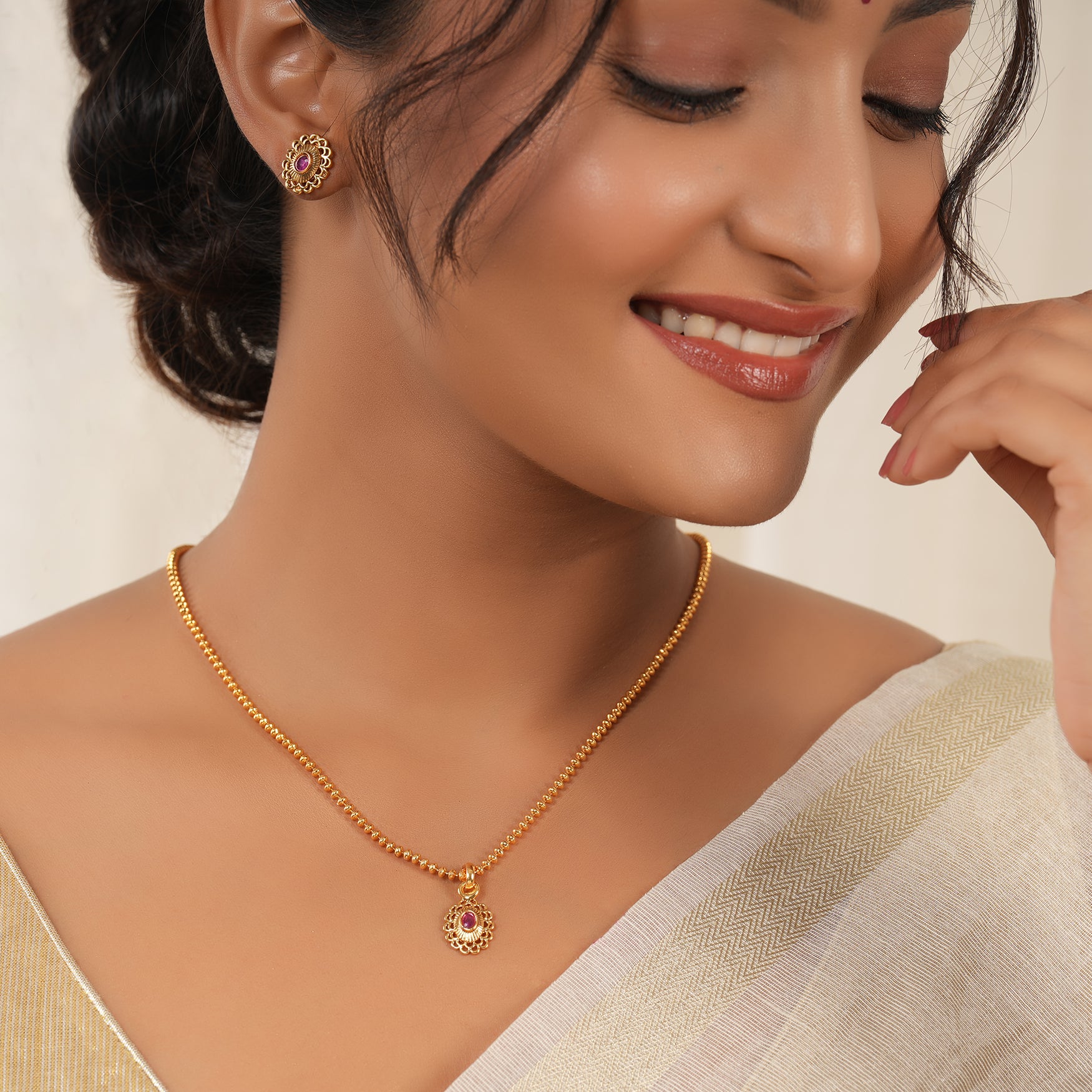 Cute oval ruby gold plated pendant set