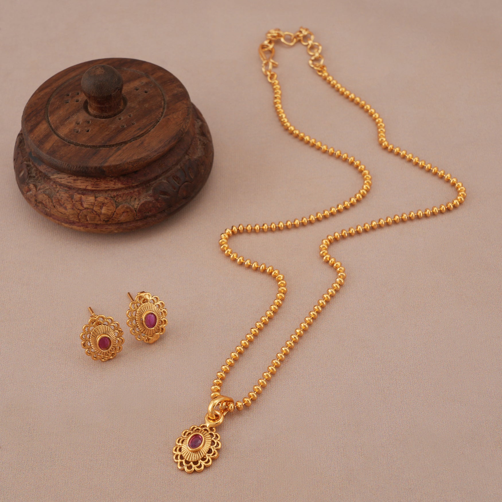Cute oval ruby gold plated pendant set