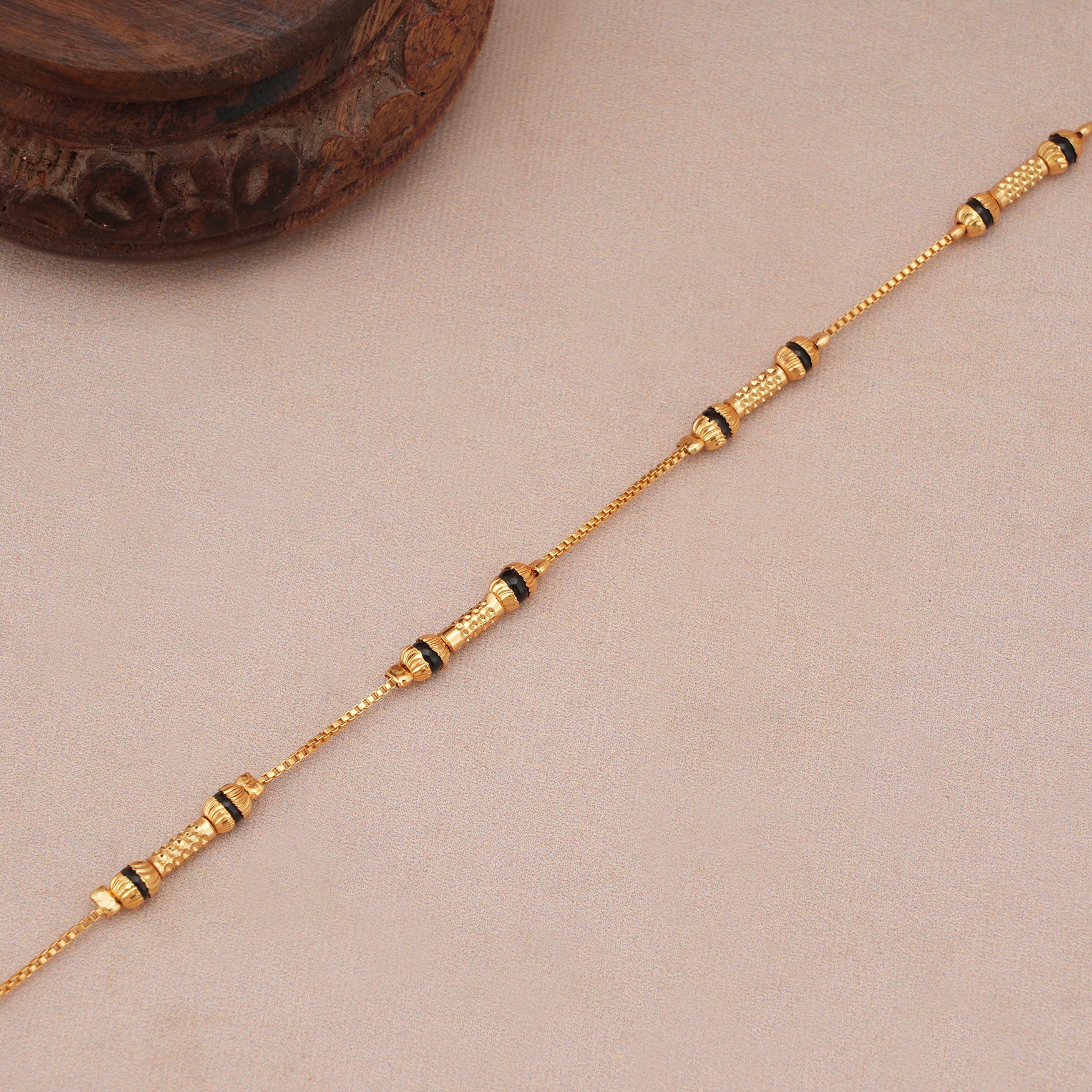 Sleek antique gold mangalsutra bracelet