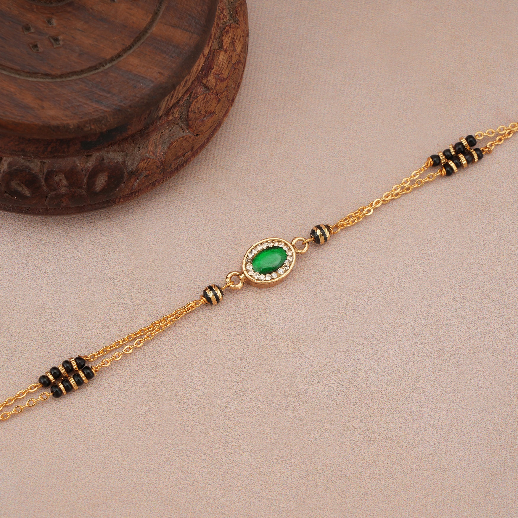 Cute sleek emerald stone mangalsutra bracelet