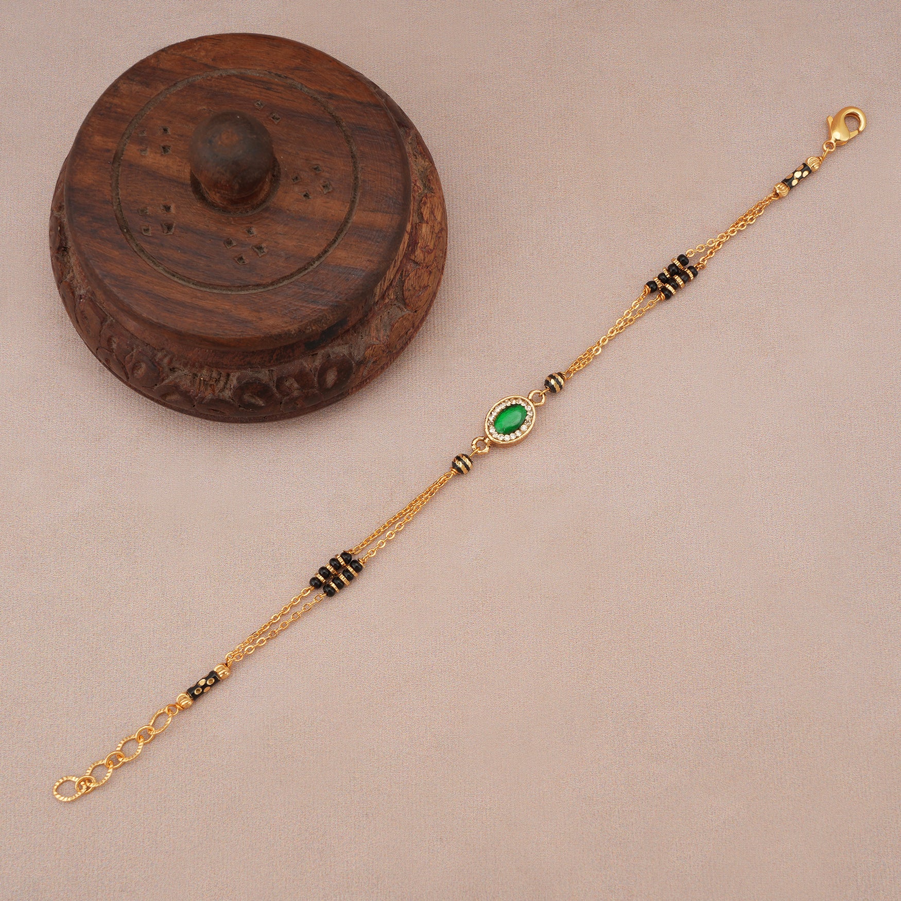 Cute sleek emerald stone mangalsutra bracelet