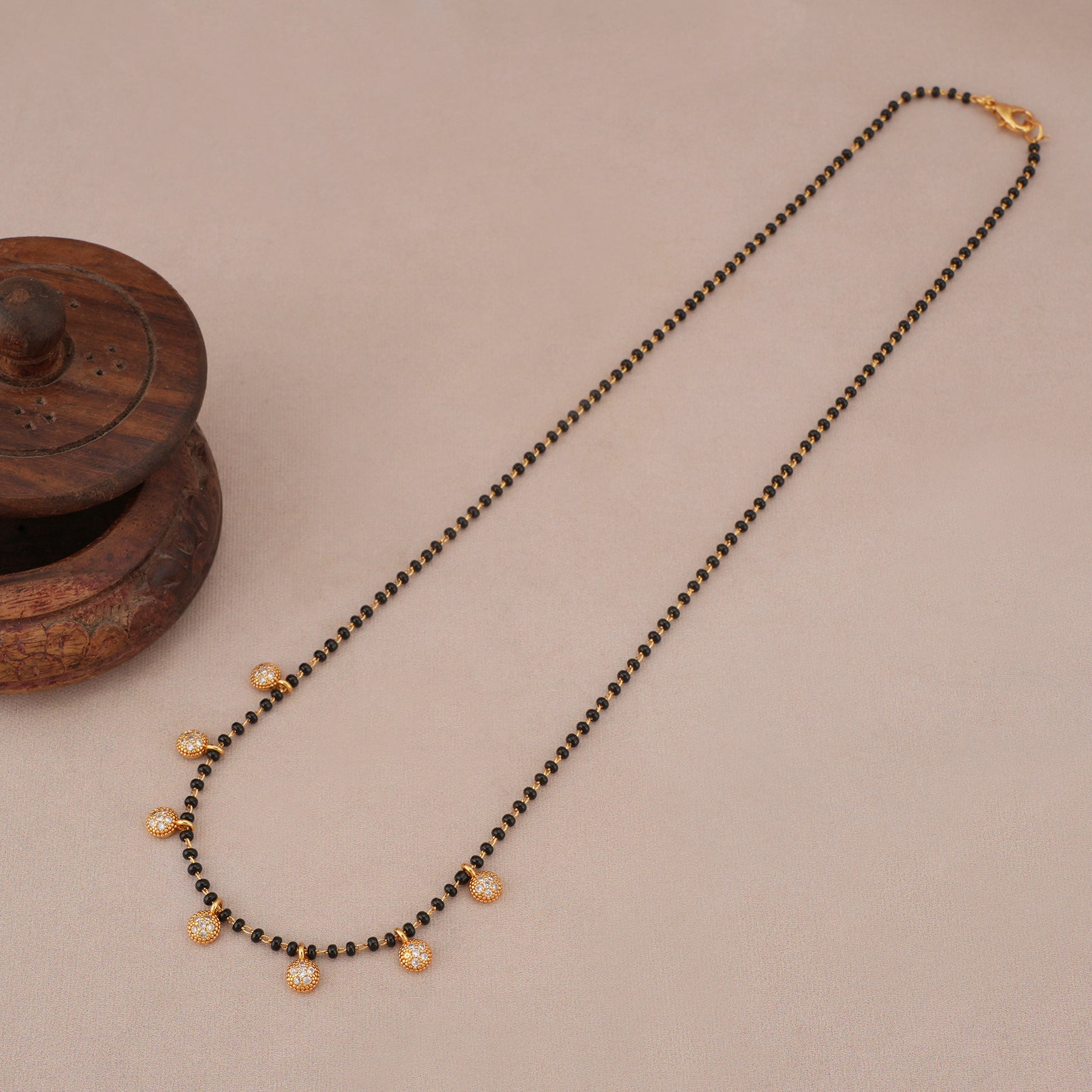 Elegant diamond ball gold plated mangalstura