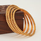 Plain sleek gold bangle set (set of 4)